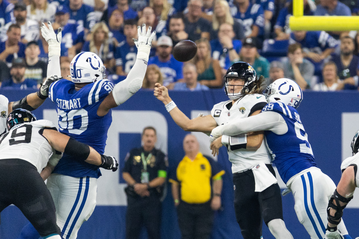 Sep 10, 2023; Indianapolis, Indiana, USA; Indianapolis Colts defensive tackle DeForest Buckner (99) forces a fumble while tackling Jacksonville Jaguars quarterback Trevor Lawrence (16) in the second half at Lucas Oil Stadium.
